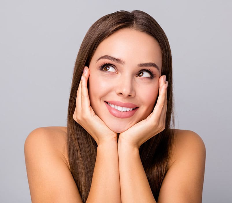 woman glancing up grinning