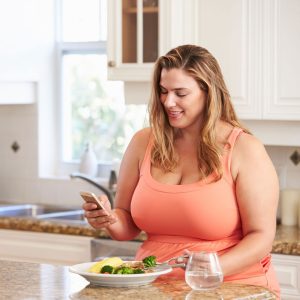 Woman eating vegetables